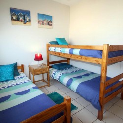 C - Front 11 is a self-catering holiday penthouse on Manaba sea front with an 180 degree sea view that sleeps 7 and is walking distance to Lucien Blue Flag Beach.