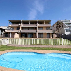 C - Front 11 is a self-catering holiday penthouse on Manaba sea front with an 180 degree sea view that sleeps 7 and is walking distance to Lucien Blue Flag Beach.