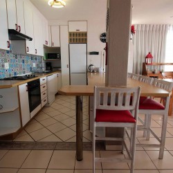 C - Front 11 is a self-catering holiday penthouse on Manaba sea front with an 180 degree sea view that sleeps 7 and is walking distance to Lucien Blue Flag Beach.