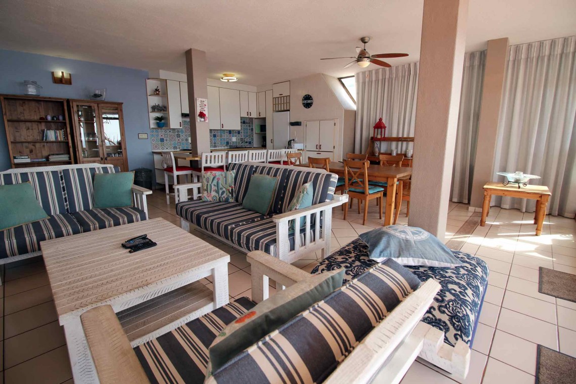 C - Front 11 is a self-catering holiday penthouse on Manaba sea front with an 180 degree sea view that sleeps 7 and is walking distance to Lucien Blue Flag Beach.