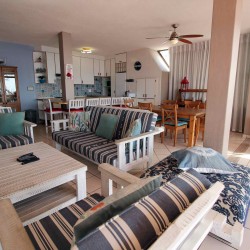 C - Front 11 is a self-catering holiday penthouse on Manaba sea front with an 180 degree sea view that sleeps 7 and is walking distance to Lucien Blue Flag Beach.