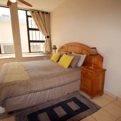 C - Front 11 is a self-catering holiday penthouse on Manaba sea front with an 180 degree sea view that sleeps 7 and is walking distance to Lucien Blue Flag Beach.