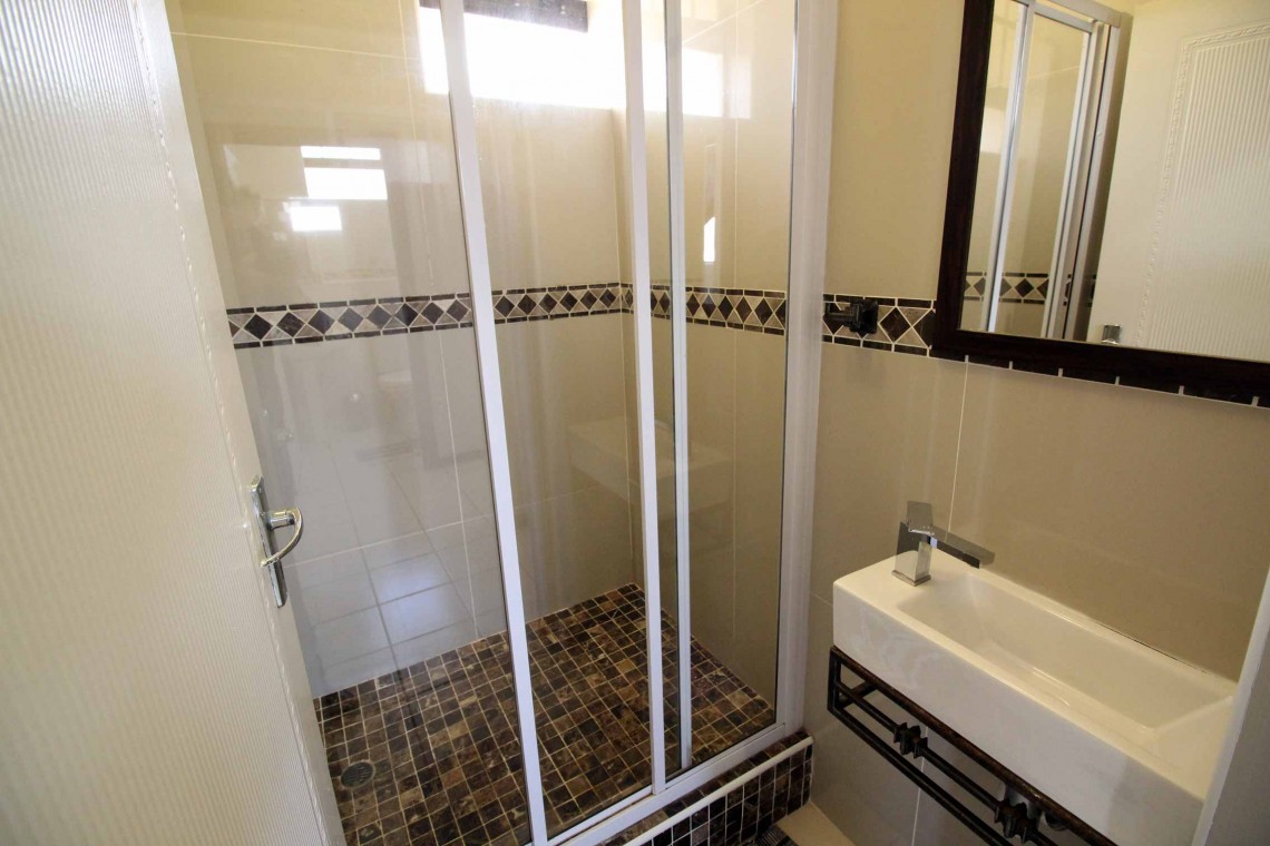 C - Front 11 is a self-catering holiday penthouse on Manaba sea front with an 180 degree sea view that sleeps 7 and is walking distance to Lucien Blue Flag Beach.