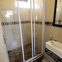 C - Front 11 is a self-catering holiday penthouse on Manaba sea front with an 180 degree sea view that sleeps 7 and is walking distance to Lucien Blue Flag Beach.