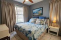 The main bedroom of Chesapeake Bay 38. The 5 sleeper self-catering holiday flat has tennis courts, pool, coin operated laundry and jungle gym and is on the beach in Margate on the South Coast of KZN - Happy Holiday Homes