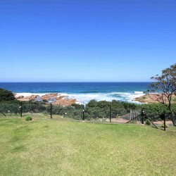 On Margate seafront Chesapeake Bay 22, activities for the kids with has tennis courts and a swimming pool - Sleeps 4 guests - South Coast KwaZulu-Natal self-catering Accommodation - Happy Holiday Homes