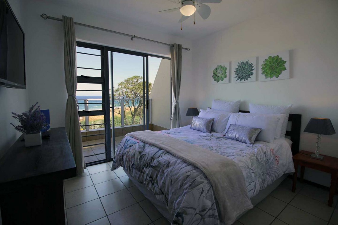 On Margate seafront Chesapeake Bay 22 has tennis courts and a swimming pool - Sleeps 4 guests - South Coast KwaZulu-Natal self-catering Accommodation - Happy Holiday Homes