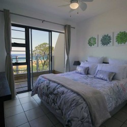 On Margate seafront Chesapeake Bay 22 has tennis courts and a swimming pool - Sleeps 4 guests - South Coast KwaZulu-Natal self-catering Accommodation - Happy Holiday Homes