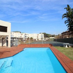 On Margate seafront Chesapeake Bay 22 has tennis courts and a swimming pool - Sleeps 4 guests - South Coast KwaZulu-Natal self-catering Accommodation - Happy Holiday Homes