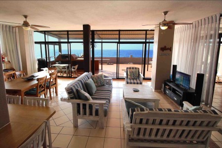 C - Front 11 is a self-catering holiday penthouse on Manaba sea front with an 180 degree sea view that sleeps 7 and is walking distance to Lucien Blue Flag Beach.
