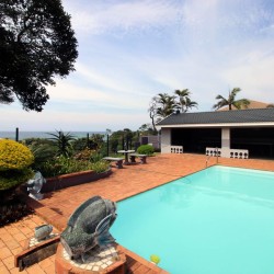 Enjoy your self-catering holiday in **Shelly Palms 6**—a perfect **beach holiday in Shelly Beach** where you can **walk onto the beach** and admire a breathtaking **sea view over the swimming pool**. Ideal for a **family holiday in shelly beach**, this coastal retreat captures the essence of a true seaside escape.
