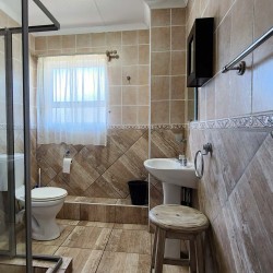 Uvongo Chalets 27 is a self-catering 6 sleeper flat on Lilliecrona Boulevard in Uvongo on the South Coast of KwaZulu Natal in South Africa. The property offers solar power with an inverter, internet, WiFi, Netflix, DSTV and filtered drinking water.