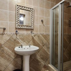 Uvongo Chalets 27 is a self-catering 6 sleeper flat on Lilliecrona Boulevard in Uvongo on the South Coast of KwaZulu Natal in South Africa. The property offers solar power with an inverter, internet, WiFi, Netflix, DSTV and filtered drinking water.