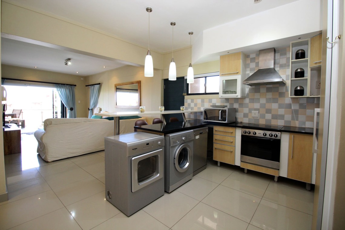 Whale Rock 16 is a 3 bedroom, 6 sleeper self-catering holiday flat in Margate on the South Coast of KZN - The kitchen.
