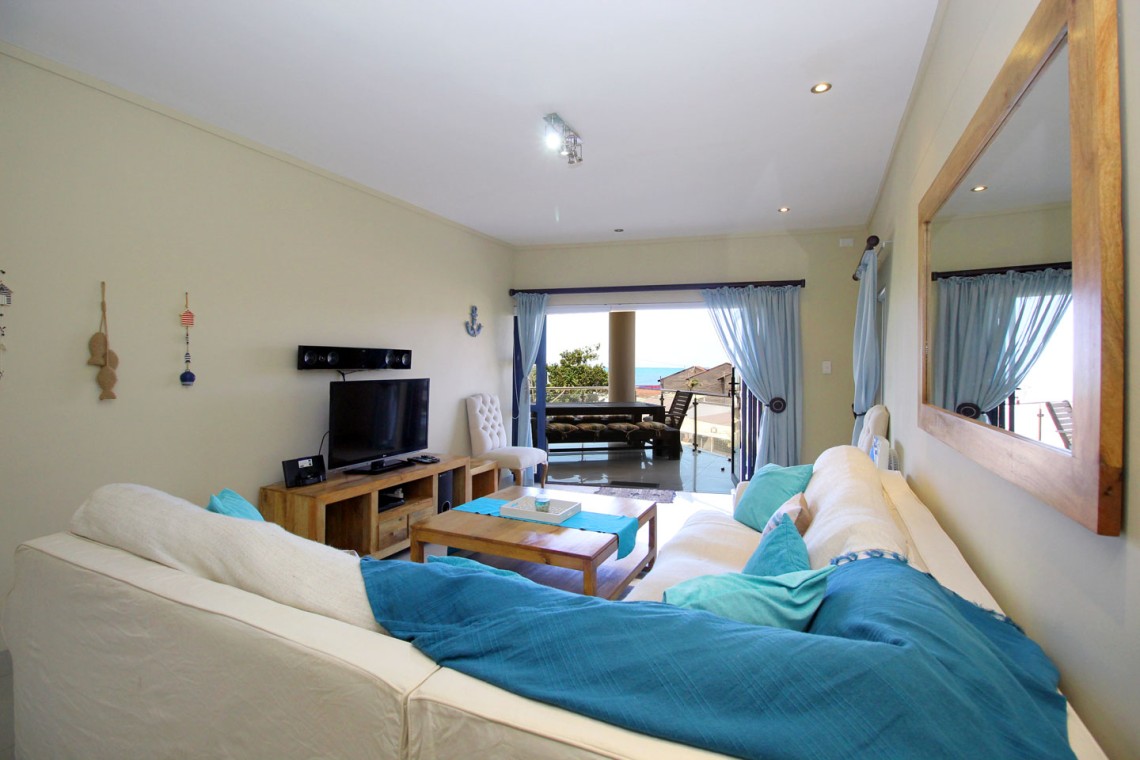 Whale Rock 16 is a 3 bedroom, 6 sleeper self-catering holiday flat in Margate on the South Coast of KZN - The lounge.