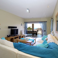 Whale Rock 16 is a 3 bedroom, 6 sleeper self-catering holiday flat in Margate on the South Coast of KZN - The lounge.