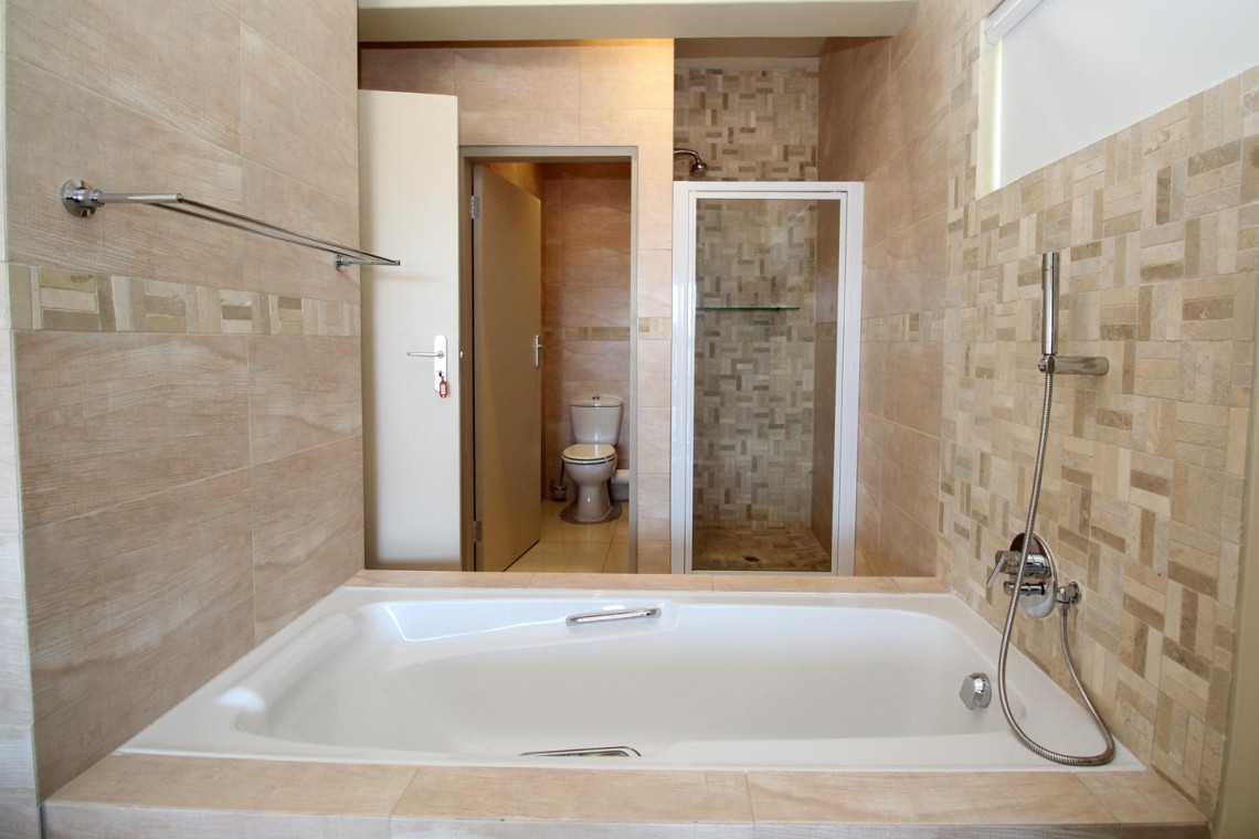 Whale Rock 16 is a 3 bedroom, 6 sleeper self-catering holiday flat in Margate on the South Coast of KZN - The en-suite bathroom shower.