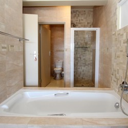 Whale Rock 16 is a 3 bedroom, 6 sleeper self-catering holiday flat in Margate on the South Coast of KZN - The en-suite bathroom shower.