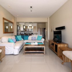 Whale Rock 16 is a 3 bedroom, 6 sleeper self-catering holiday flat in Margate on the South Coast of KZN - The open plan living.