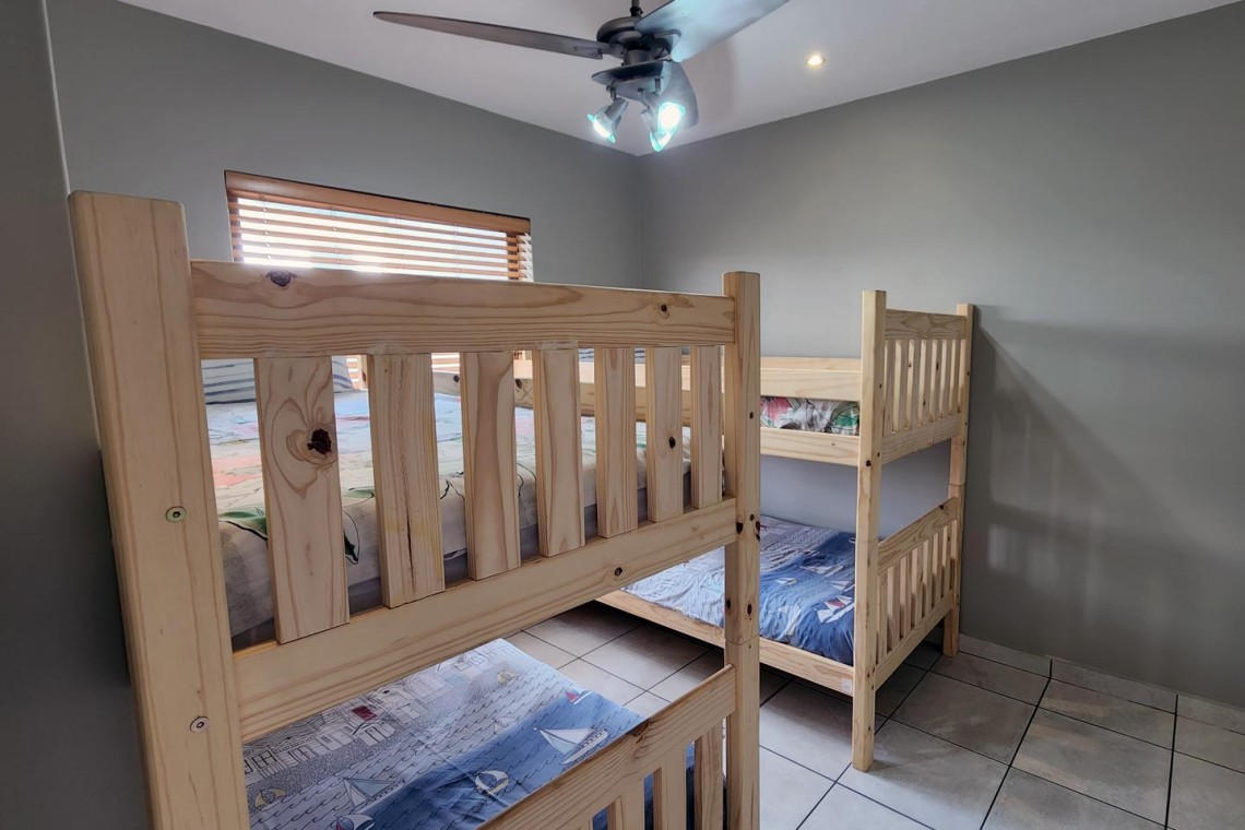 Indigo Bay 25 is a luxury, self-catering, 4 bedroom, 8 sleeper on the Manaba beachfront with stunning sea views from Lucien Beach to Margate Beach on the South Coast of KwaZulu Natal.