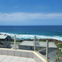 Octavia 7 is a tastefully furnished, upmarket 6 sleeper self-catering holiday penthouse in Manaba Beach on the South Coast of KwaZiulu Natal with a 180 ° breaker sea view.