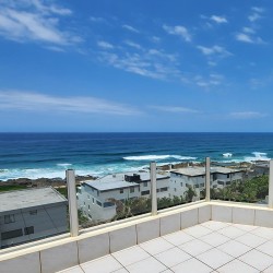 Octavia 7 is a tastefully furnished, upmarket 6 sleeper self-catering holiday penthouse in Manaba Beach on the South Coast of KwaZiulu Natal with a 180 ° breaker sea view.