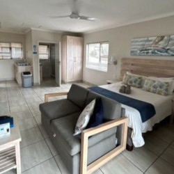 Banana Beach Club F1, a self-catering ground-floor studio in Melville on the Hibiscus Coast, located 50m from the beach, ideal for a small family holiday.