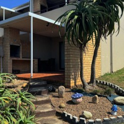 Banana Beach Club F1, a self-catering ground-floor studio in Melville on the Hibiscus Coast, located 50m from the beach, ideal for a small family holiday.