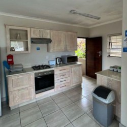 Banana Beach Club F1, a self-catering ground-floor studio in Melville on the Hibiscus Coast, located 50m from the beach, ideal for a small family holiday.
