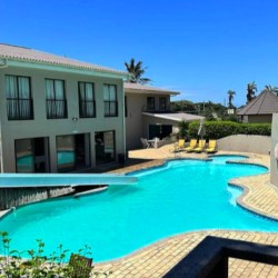 Banana Beach Club F1, a self-catering ground-floor studio in Melville on the Hibiscus Coast, located 50m from the beach, ideal for a small family holiday.