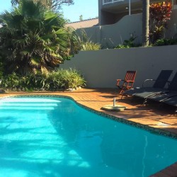 Banana Beach Club F1, a self-catering ground-floor studio in Melville on the Hibiscus Coast, located 50m from the beach, ideal for a small family holiday.