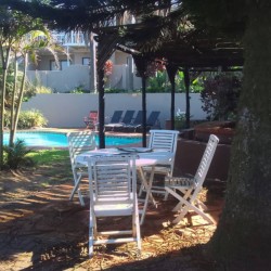 Banana Beach Club F1, a self-catering ground-floor studio in Melville on the Hibiscus Coast, located 50m from the beach, ideal for a small family holiday.