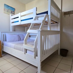 The third bedroom at C - Front 11, a self-catering holiday penthouse on Manaba sea front with an 180 degree sea view that sleeps 7 and is walking distance to Lucien Blue Flag Beach.