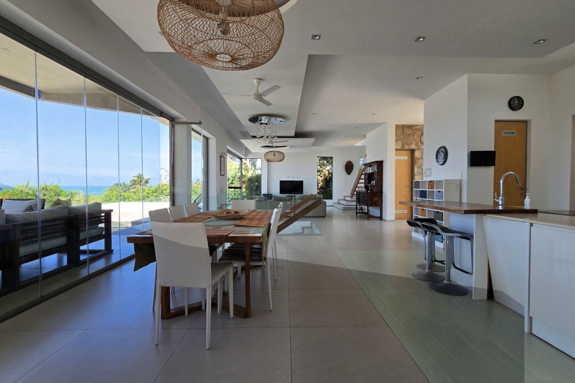 Strachan 2127 is a luxury holiday home in Ramsgate, located on the beachfront of Ramsgate Beach. This stunning sea-view rental in KwaZulu-Natal offers breathtaking ocean views, an infinity pool, and modern comforts—making it the perfect family-friendly getaway in South Africa.
