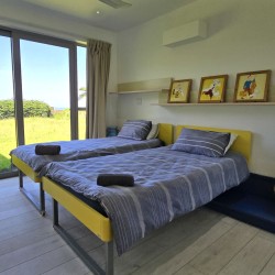 Strachan 2127 is a luxury holiday home in Ramsgate, located on the beachfront of Ramsgate Beach. This stunning sea-view rental in KwaZulu-Natal offers breathtaking ocean views, an infinity pool, and modern comforts—making it the perfect family-friendly getaway in South Africa.