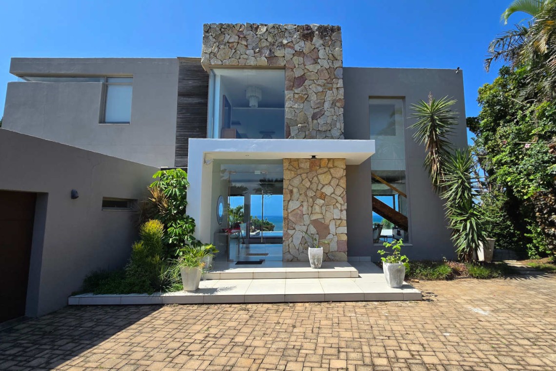 Strachan 2127 is a luxury holiday home in Ramsgate, located on the beachfront of Ramsgate Beach. This stunning sea-view rental in KwaZulu-Natal offers breathtaking ocean views, an infinity pool, and modern comforts—making it the perfect family-friendly getaway in South Africa.