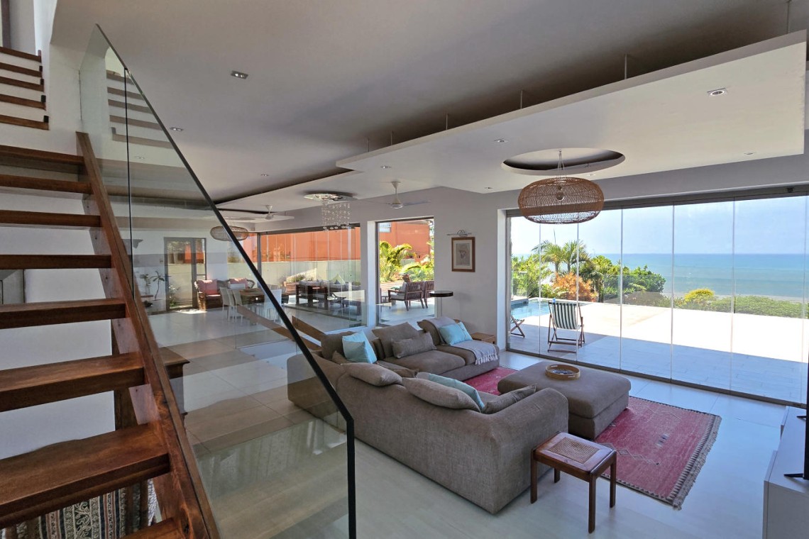 Strachan 2127 is a luxury holiday home in Ramsgate, located on the beachfront of Ramsgate Beach. This stunning sea-view rental in KwaZulu-Natal offers breathtaking ocean views, an infinity pool, and modern comforts—making it the perfect family-friendly getaway in South Africa.