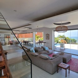 Strachan 2127 is a luxury holiday home in Ramsgate, located on the beachfront of Ramsgate Beach. This stunning sea-view rental in KwaZulu-Natal offers breathtaking ocean views, an infinity pool, and modern comforts—making it the perfect family-friendly getaway in South Africa.