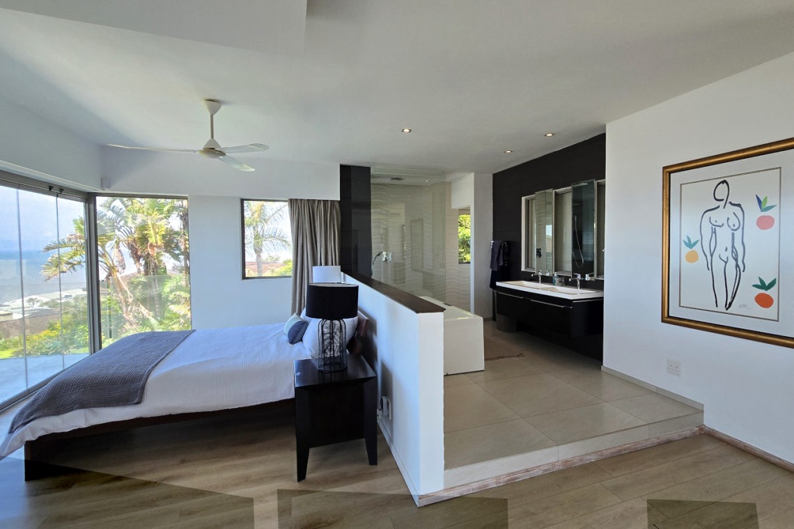 Strachan 2127 is a luxury holiday home in Ramsgate, located on the beachfront of Ramsgate Beach. This stunning sea-view rental in KwaZulu-Natal offers breathtaking ocean views, an infinity pool, and modern comforts—making it the perfect family-friendly getaway in South Africa.