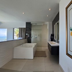 Strachan 2127 is a luxury holiday home in Ramsgate, located on the beachfront of Ramsgate Beach. This stunning sea-view rental in KwaZulu-Natal offers breathtaking ocean views, an infinity pool, and modern comforts—making it the perfect family-friendly getaway in South Africa.