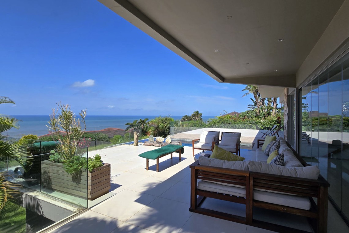 Strachan 2127 is a luxury holiday home in Ramsgate, located on the beachfront of Ramsgate Beach. This stunning sea-view rental in KwaZulu-Natal offers breathtaking ocean views, an infinity pool, and modern comforts—making it the perfect family-friendly getaway in South Africa.
