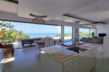Strachan 2127 is a luxury holiday home in Ramsgate, located on the beachfront of Ramsgate Beach. This stunning sea-view rental in KwaZulu-Natal offers breathtaking ocean views, an infinity pool, and modern comforts—making it the perfect family-friendly getaway in South Africa.