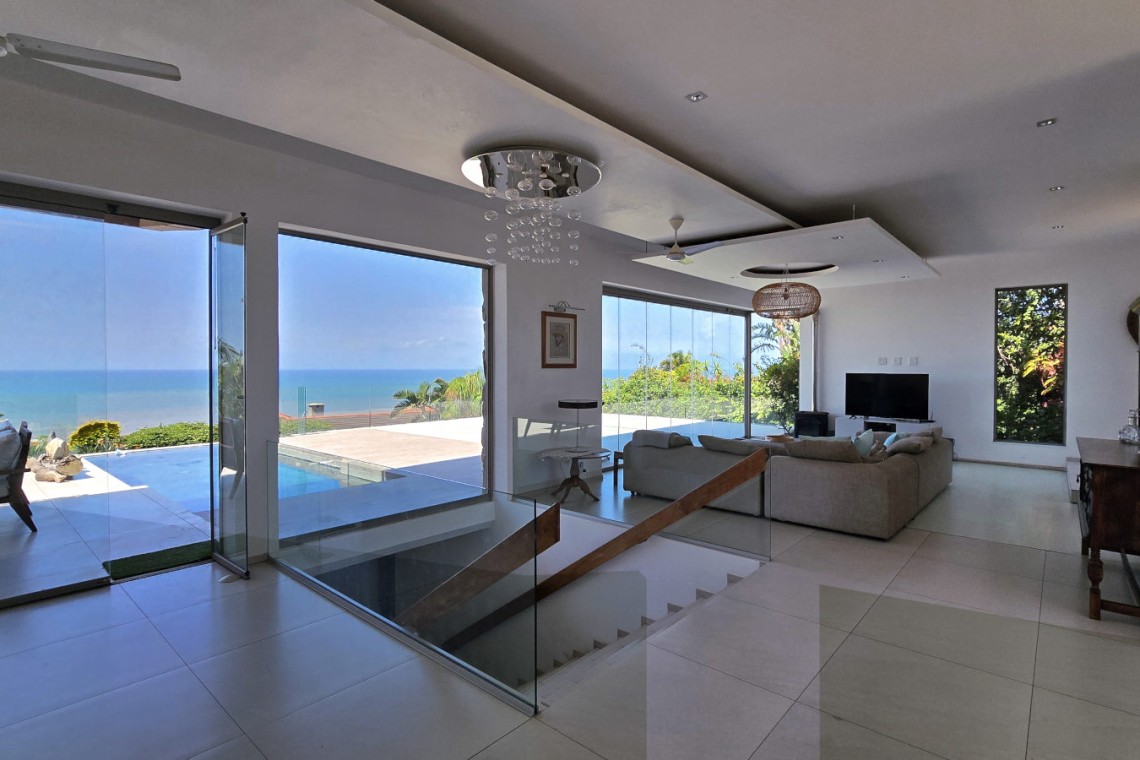 Strachan 2127 is a luxury holiday home in Ramsgate, located on the beachfront of Ramsgate Beach. This stunning sea-view rental in KwaZulu-Natal offers breathtaking ocean views, an infinity pool, and modern comforts—making it the perfect family-friendly getaway in South Africa.