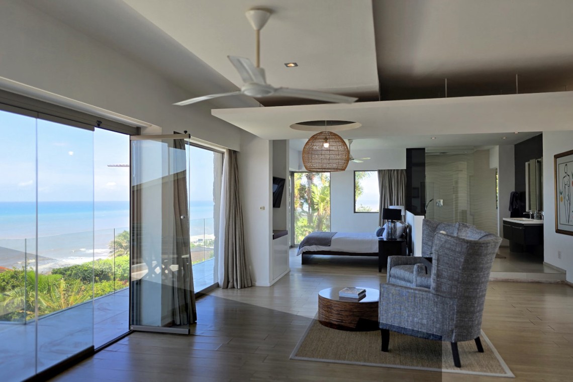 Strachan 2127 is a luxury holiday home in Ramsgate, located on the beachfront of Ramsgate Beach. This stunning sea-view rental in KwaZulu-Natal offers breathtaking ocean views, an infinity pool, and modern comforts—making it the perfect family-friendly getaway in South Africa.