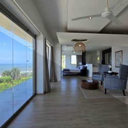 Strachan 2127 is a luxury holiday home in Ramsgate, located on the beachfront of Ramsgate Beach. This stunning sea-view rental in KwaZulu-Natal offers breathtaking ocean views, an infinity pool, and modern comforts—making it the perfect family-friendly getaway in South Africa.