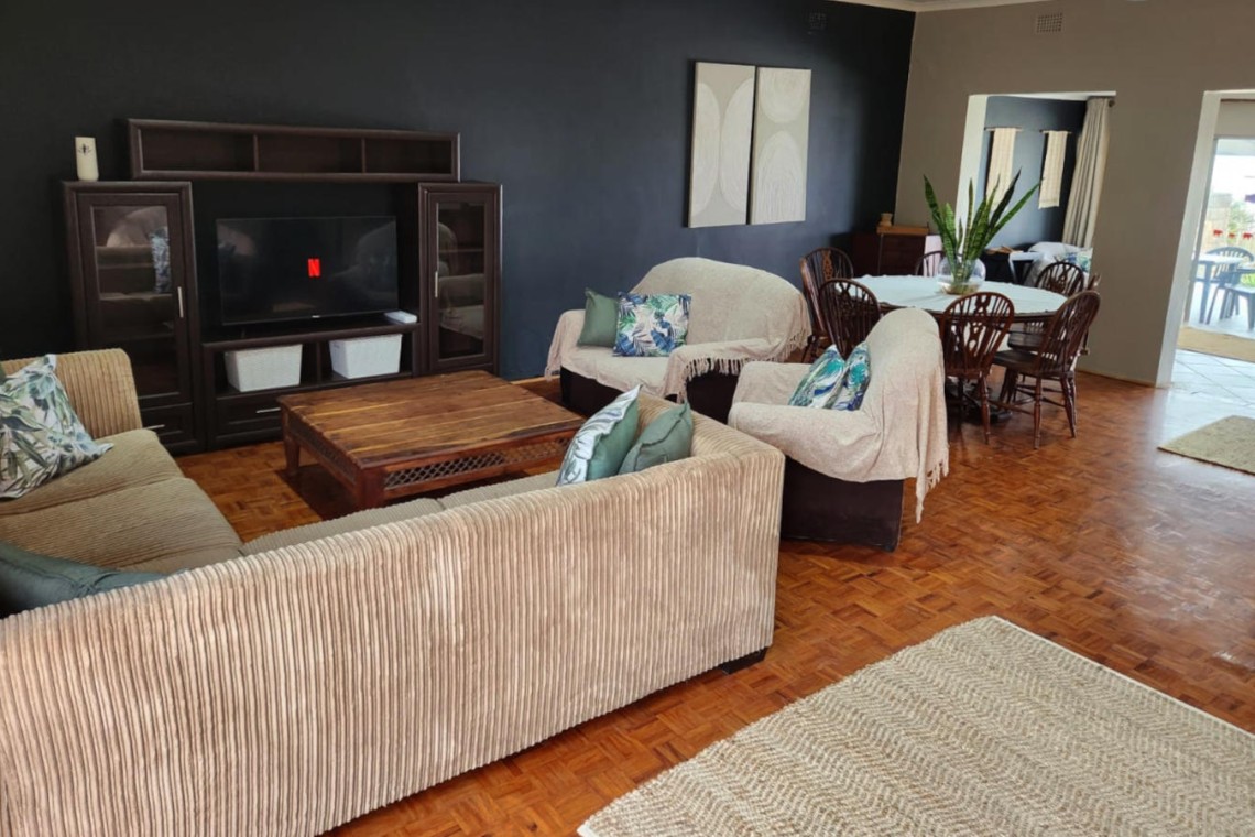 Sea Park House the spacious lounge with Smart TV in holiday home with sea view in Sea Park on the South Coast of KwaZulu Natal