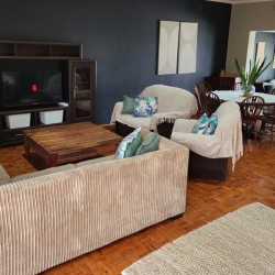 Sea Park House the spacious lounge with Smart TV in holiday home with sea view in Sea Park on the South Coast of KwaZulu Natal