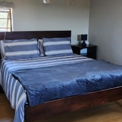 Sea Park Beach House - Downstairs bedroom in holiday home with sea view in Sea Park on the South Coast of KwaZulu Natal