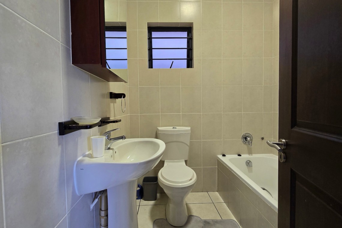 Second bathroom at Topanga 25, a spacious beachfront holiday rental in Uvongo perfect for families seeking comfort and convenience close to Uvongo beach.