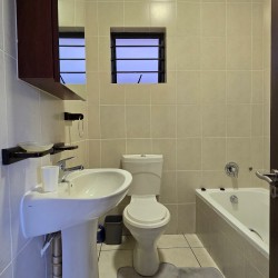 Second bathroom at Topanga 25, a spacious beachfront holiday rental in Uvongo perfect for families seeking comfort and convenience close to Uvongo beach.
